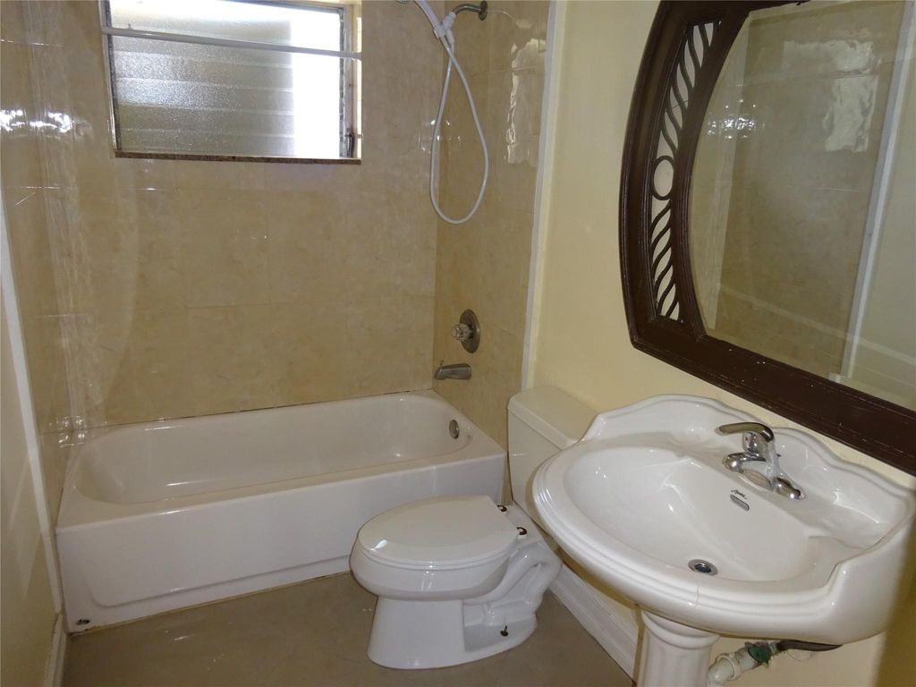 Photo of 740 E Evanston Circle E, Fort Lauderdale, FL 33312 (MLS # B26044108)