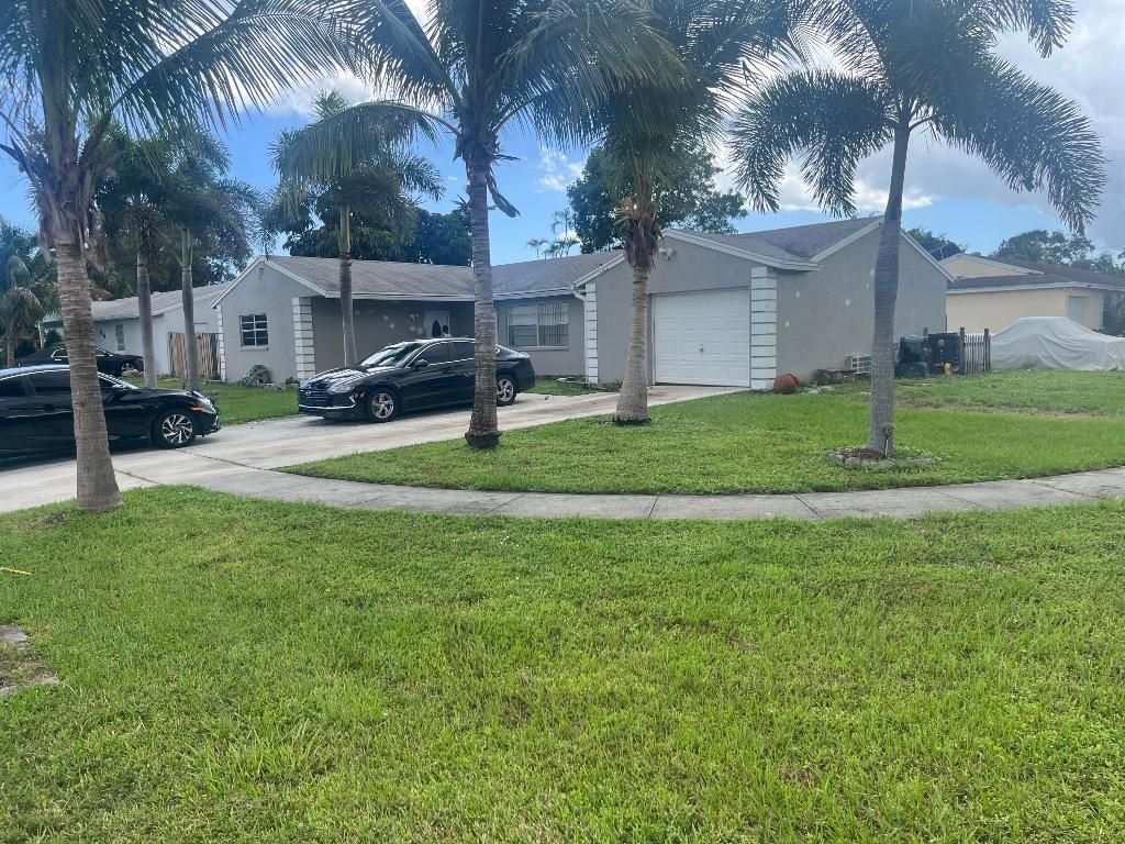Photo of 4150 Lilac Circle, Lake Worth, FL 33461 (MLS # R11130989)