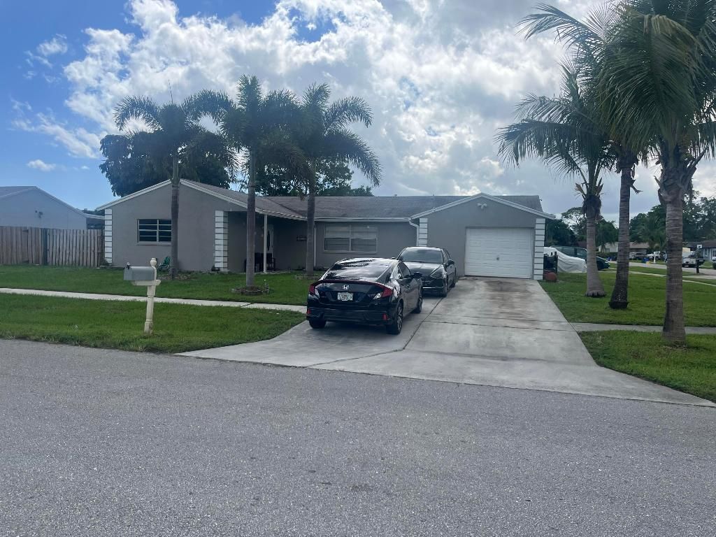 Photo of 4150 Lilac Circle, Lake Worth, FL 33461 (MLS # R11130989)