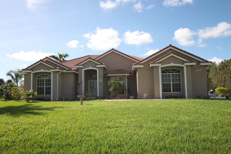 From the moment you enter into this immaculate home you will be taken by the spacious ''open'' feeling. Standing on the raised entrance you are invited out onto the large living area as you are taking in the great views of pool and patio area.  The Master bedroom features a large sitting area, crown molding, french doors,huge walk in closets,designer ''claw foot'' tub, granite counter top, dual sinks, and 10'ceilings. The Gourmet kitchen boasts upgraded Stainless Steel appliances, granite counters, a chefs dream!  Eat in kitchen is perfect for entertaining family and friends as they also get a view of the sun filled pool and patio! Be a part of sunny south Florida in this one of a kind gem minutes to beaches,  shopping, airport and major highways. An absolute gem!