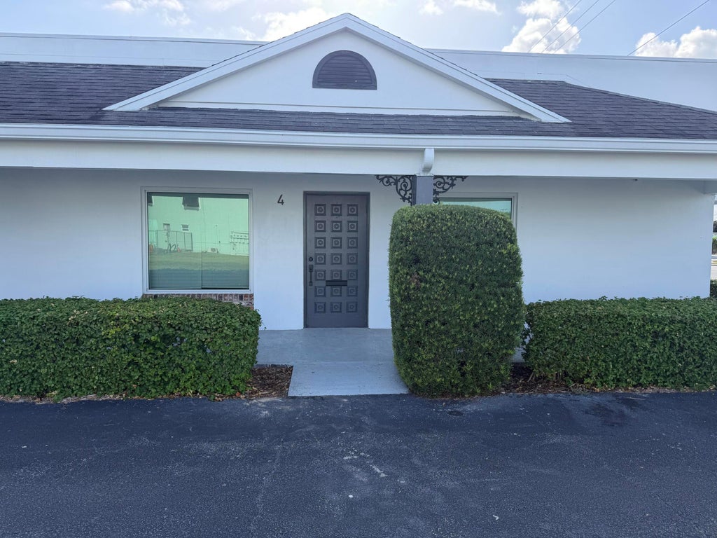 Photo of 401 W Lantana Road, Lantana, FL 33462 (MLS # B26074051)