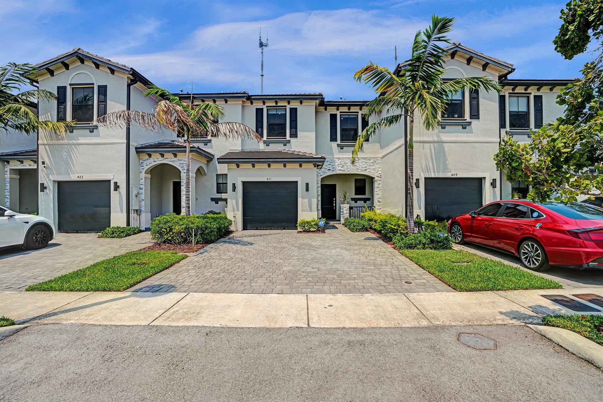 Welcome to this modern 2022-built townhouse in a gated community that puts you right where you want to be. The open-concept layout features a sleek kitchen with granite countertops that flows into the dining and living space, leading out to a patio and backyard with lake views--ideal for morning coffee or evening hangouts. Upstairs you'll find three bedrooms, including a spacious master suite with a private bath, plus a second full bathroom and laundry conveniently on the same level. The home also includes an attached garage and a downstairs half bath. Community perks include a pool, gym, clubhouse, and playground. Best part? You're just minutes from major highways, Hard Rock Stadium, Topgolf, grocery stores, dining, and more--everything you need is right here!