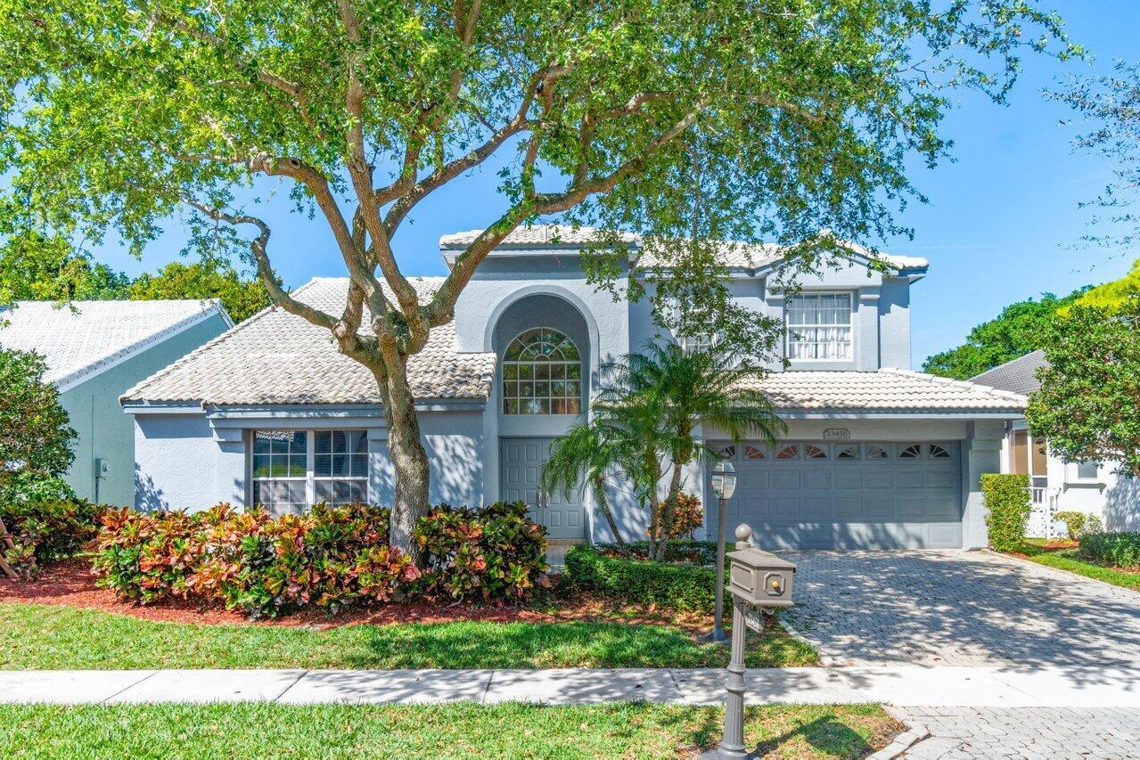 This luxurious 4 bedroom home, nestled within one of Boca Pointe's premier gated communities, epitomizes modern comfort and convenience. The home features a luxurious downstairs primary suite, so residents can enjoy a lavishly renovated master bath with an oversized shower/tub/frameless combo, double sink vanity with quartz counter tops, designer chandelier, and slate floors. The 12 foot high primary custom-built walk-in closet offers plenty of storage options for all of your wardrobe. The state-of-the-art kitchen boasts quartz countertops, pullout drawers, a GE Cafe appliance package, including a full refrigerator with a built-in water/ice dispenser and a Keurig(r) K-Cup(r) brewing system. There is an additional wall length pantry area complete with double drawer refrigerators and a wine