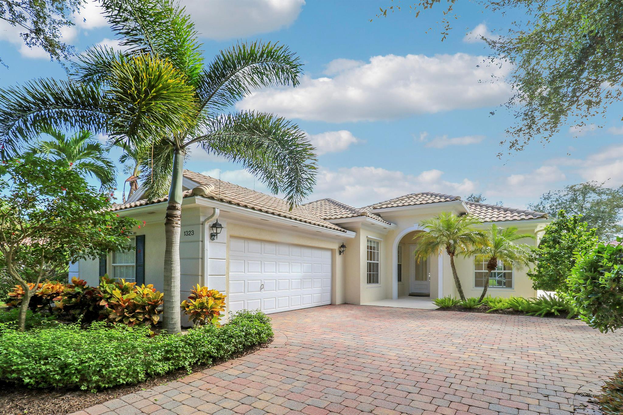 Beautiful home in The Isles of Palm Beach Gardens meticulously maintained by one owner! The solid concrete DiVosta built home  features 3 bed+den, 2.1 baths, with tasteful updates throughout! Enjoy stunning sunsets and long lake views from the expansive screened-in patio, large enough to accommodate a pool and perfect for entertaining or relaxing by the water in your serene backyard setting. With its fantastic location near world-class dining, shopping, golf, beaches, and major highways, this pristine property combines quality, comfort, and convenience in one of Palm Beach Gardens' most sought-after communities. The Isles offers resort-style amenities incl. heated pool, fitness center and pickleball courts.  HOA incl. lawn maintenance, cable / internet, and ADT home security monitoring!