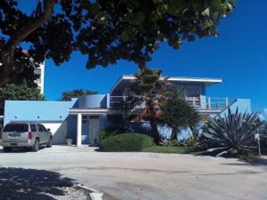 Lowest price oceanfront land in PBC! 1950's Contemporary Malibu style beach house comes with it! 4 br 3 bath with black bottom pool, marble/wood floors throughout, could be multi generational with living areas, kitchens and master bedrooms with ensuite baths on both floors, separate entrances, main kitchen has granite counters, wood cabinets, stainless appliances, stainless tile backsplash, marble and hardwood floors, all major rooms have direct southeast ocean views, lots of storage, 2 car garage, carport, steps to beach, 10 minutes to palm beach international airport, newly painted exteriors, north property line borders palm beach, beach newly renourished, update or renovate to your taste or rebuild, don't miss this opportunity to live la vida for less! Survey available, call today!