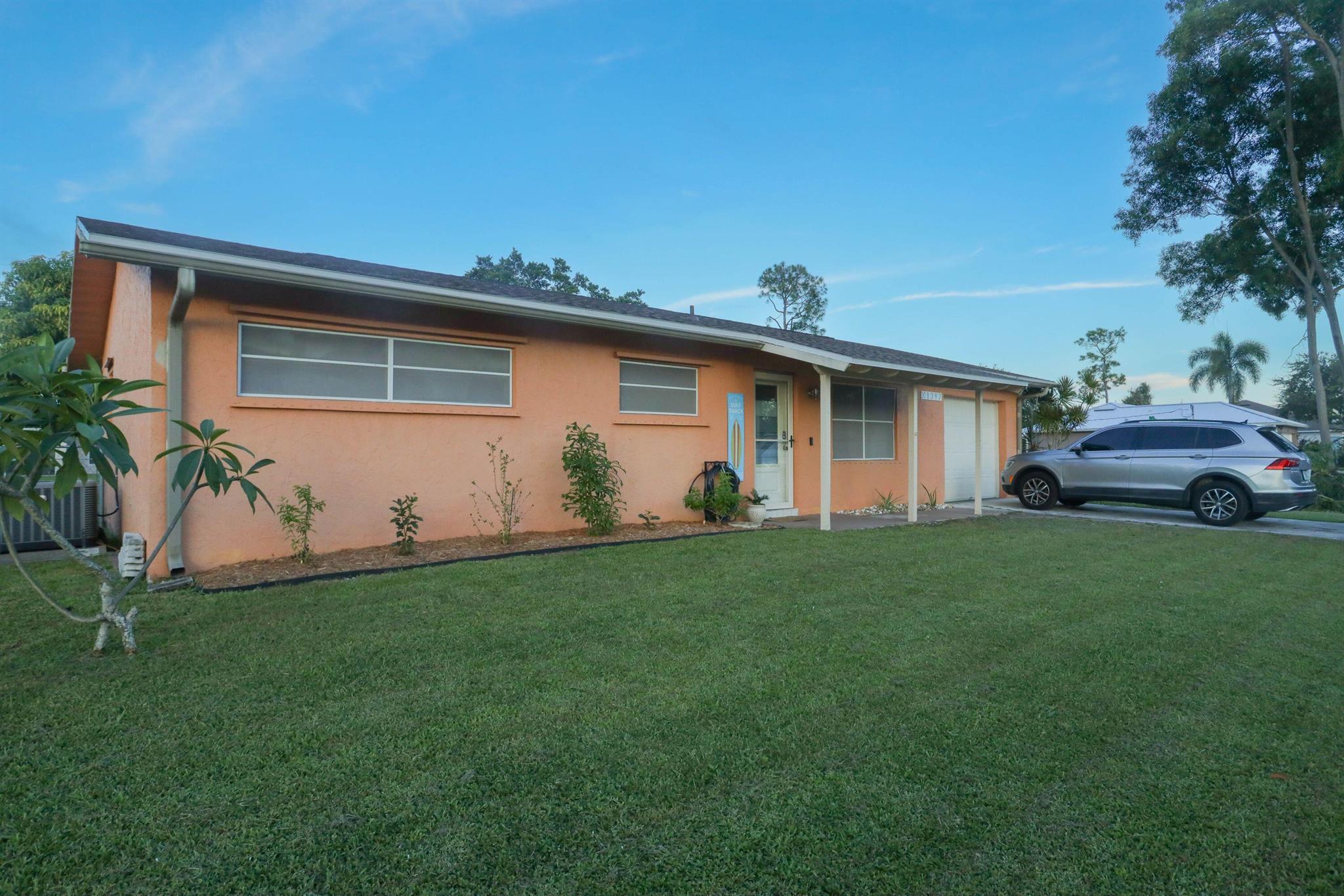 This beautifully remodeled 2-bedroom, 2-bathroom single-family home with an extra large garage is a true gem in this friendly neighborhood, perfect as a starter home. The stacked bedrooms and 2 updated bathrooms offer a cozy and efficient layout, while the brand-new kitchen shines with quartz countertops, high-end newer appliances, and a wide-open, modern design perfect for entertaining. Enjoy relaxing on the enclosed porch, which overlooks a spacious, beautifully landscaped fenced backyard, complete with a mature mango tree, a storage shed, and a charming lighted fireplace ideal for privacy and outdoor gatherings. The home has a brand NEW ROOF and hot water tank, ensuring worry-free living. Move-in ready with contemporary charm. All sizes approximate. Buyer to verify all data.