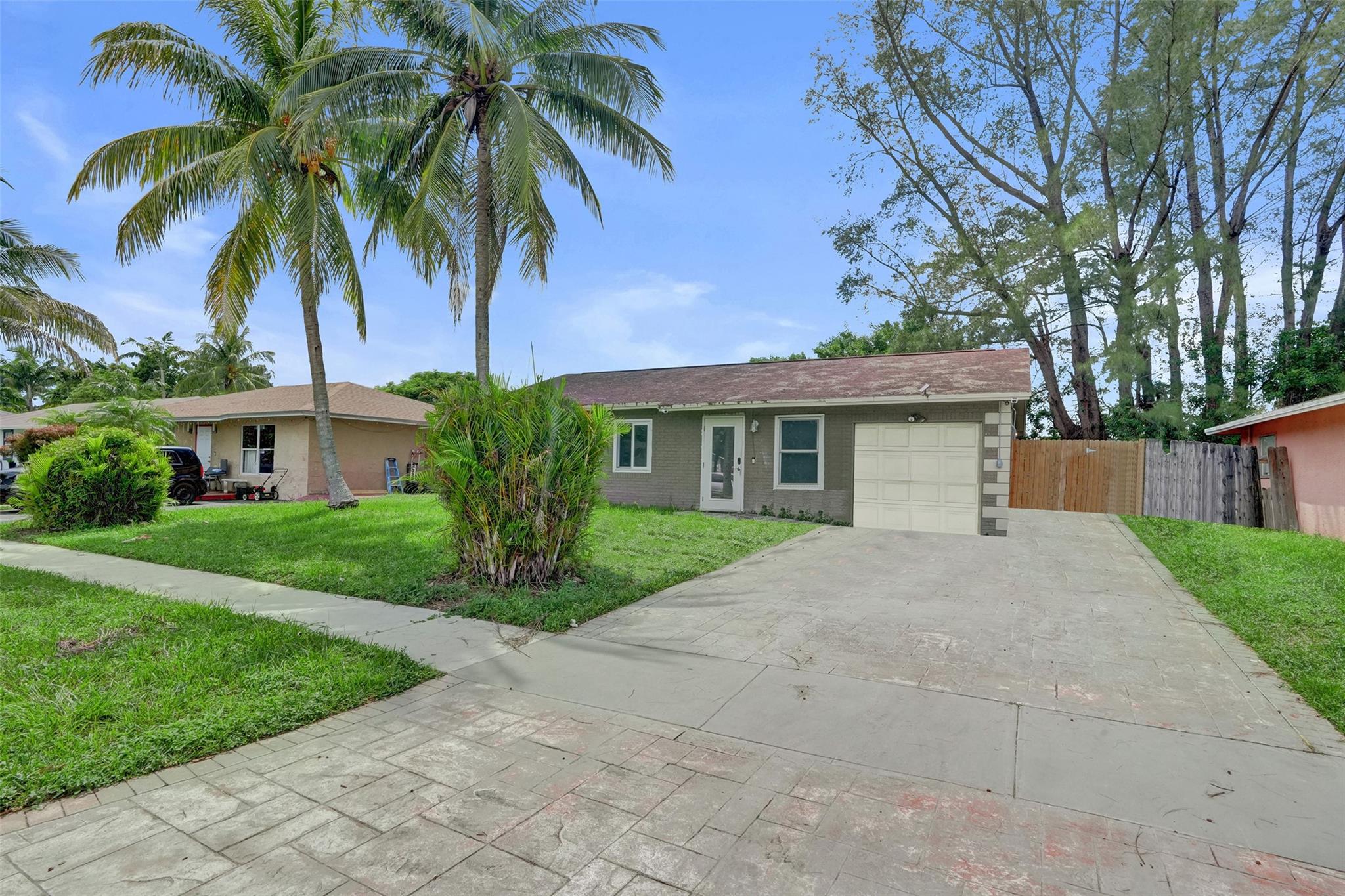 Charming 3-Bedroom, 2-Bathroom Home in North Lauderdale. Move-in ready and waiting for you! This well-kept property includes water and electricity in the rent, giving you comfort and savings. Enjoy a bright and spacious layout, a private backyard for relaxation, and the convenience of in-home laundry. Ideally located near schools, shopping, and major highways. First month’s rent and security deposit required. Schedule your private tour today!
