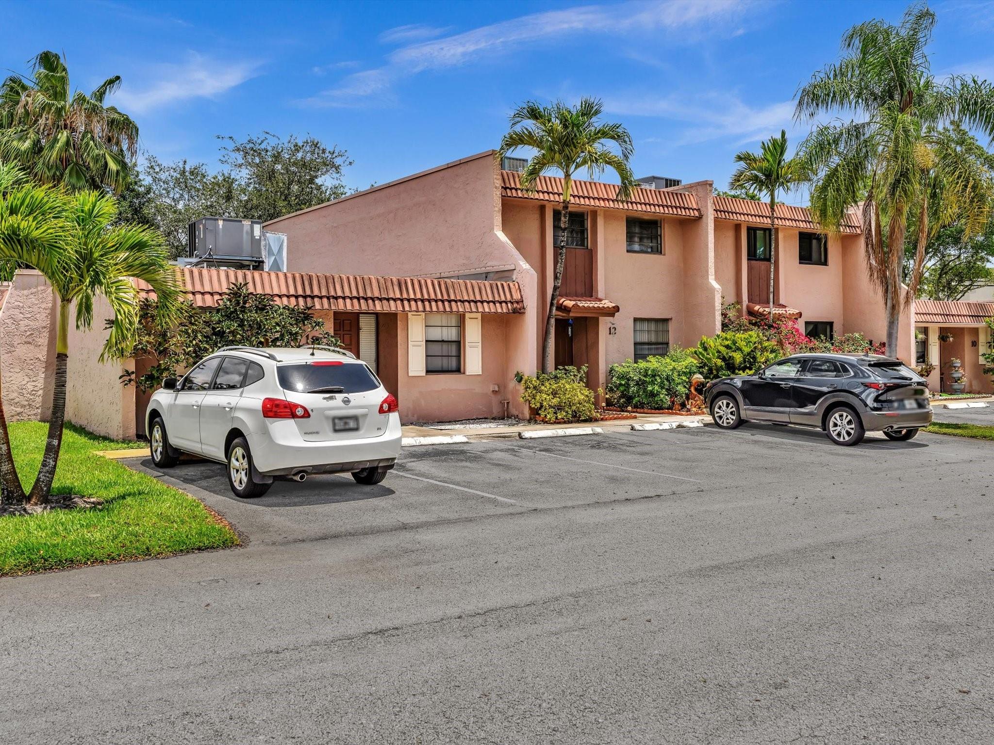 Nestled in the heart of Davie, this delightful 2-bedroom townhouse at 12 Toledo Court offers a serene living experience with the convenience of city life. 
Step inside to a spacious living area bathed in natural light from expansive windows, creating a warm, inviting atmosphere. The open-plan design seamlessly connects the living room to the dining area, which peers out onto a screened patio. Beyond, an extended paver patio is embraced by mature landscaping, offering a tranquil outdoor retreat.
Upstairs, two cozy bedrooms await, accompanied by a full bathroom, ensuring privacy and comfort. A convenient half bath downstairs caters to guests and daily living. Unlike many, this home boasts an in-unit laundry closet, adding to the ease of your daily routine.