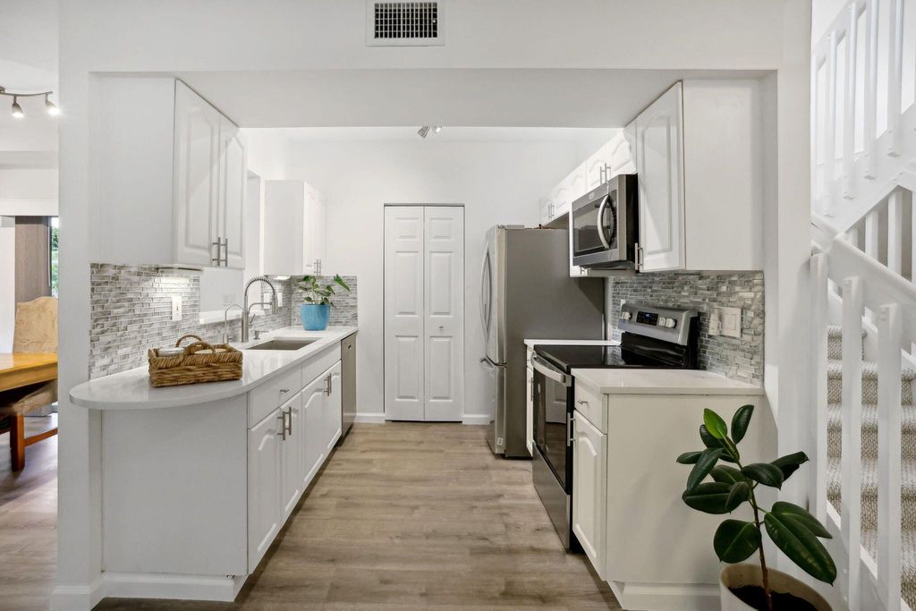 Photo of 1085 Via Jardin, Riviera Beach, FL 33418 (MLS # R11001913)