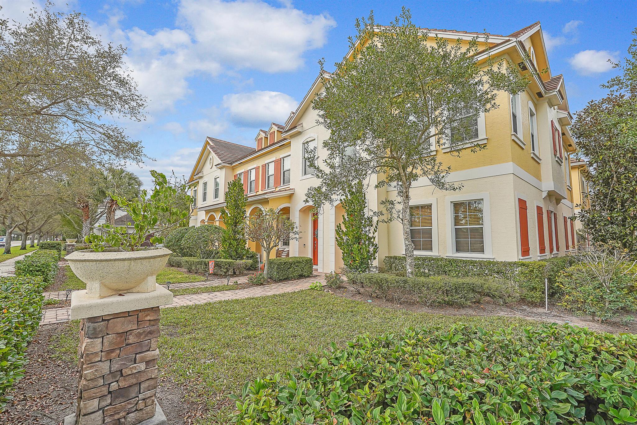 Beautifully maintained 3 BR, 2.5 BA end unit townhome with the largest floor plan in Canterbury Place. Enjoy a spacious private courtyard with covered walkway to the 2 car garage--perfect for outdoor dining, BBQ's & entertaining. Inside, you'll find new wood floors, a bright open kitchen with granite countertops, island, stainless steel appliances & plenty of prep space, plus a versatile area upstairs ideal for a home office, playroom or den. Also has impact glass. The community offers resort-style amenities including a heated pool, state-of-the-art fitness center & aerobics room. Located within walking distance to top-rated schools & minutes from Downtown Abacoa's shops, dining, stadium, amphitheater & Jupiter's beautiful beaches. Available now - don't miss this... (See Supplement)