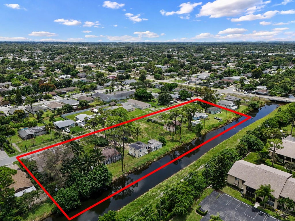 Photo of 437 FLEMING Avenue, Greenacres, FL 33463 (MLS # B26059608)