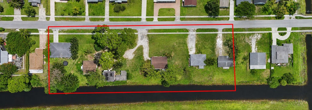 Photo of 437 FLEMING Avenue, Greenacres, FL 33463 (MLS # B26059608)