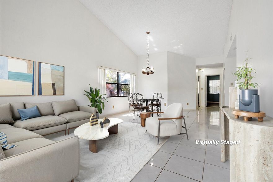 Beautiful move-in ready one-level lakefront villa featuring fresh paint, tile in main living areas, and vinyl wood floors in bedrooms. Open floor plan includes updated kitchen countertops, laundry in pantry, and access to a covered screened patio from the living room and primary suite. The primary offers an ensuite bath and walk-in closet, plus extra patio storage. Enjoy serene lake views with lush tree cover. Grenadier Lakes at Welleby provides 2 assigned parking spaces, pool, clubhouse, tennis courts just across the street and the HOA fee includes building/structure insurance. Conveniently located near Oakland Park Blvd, shops, dining, Sawgrass Expressway, and more.