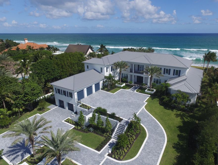 Stunning, brand new Ocean-to-Lake estate on an oversized premier Manalapan lot with 150+/- feet of direct ocean frontage. Built by Farrell Building Company, this oceanfront estate seamlessly captures the essence of what is demanded in a beachfront dream home. Stunning water views are featured from all principal rooms, waterfront balconies, and expansive outdoor living spaces including an oceanfront loggia, 64' pool, spa, and summer kitchen. The estate boasts 7 bedrooms, 7.3 baths, library, elevator, 7 car garage, club room, and wine cellar.