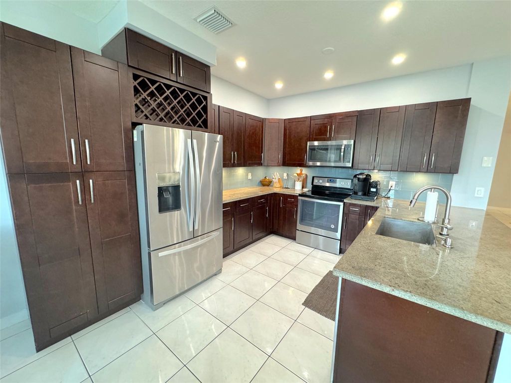 Photo of 143 NW 107th Terrace, Plantation, FL 33324 (MLS # B26040758)