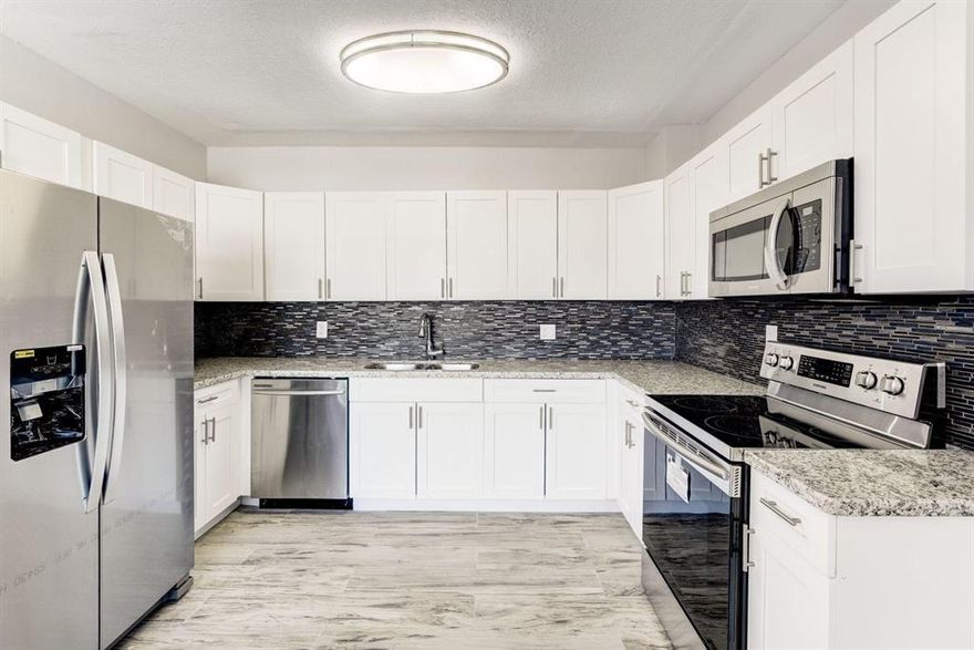 Just bring your toothbrush!!! Completely renovated from the floor to the ceiling. Single family detached, with 3 bedrooms and 2 bathrooms, tile throughout the whole house, new 5 1/4 baseboards,  custom remodeled bathrooms, brand New AC System, New designer shower rooms, New Vanities and Mosaic tile in both bathrooms.The kitchen offers gorgeous granite countertops with a matching mosaic tile backsplash. Newer Stainless Steel appliances in the kitchen. Spacious back yard with fruit trees and room to have more,  Close enough to I95-far enough to live cozy, close distance to beaches, and restaurants. The only thing missing is YOU!