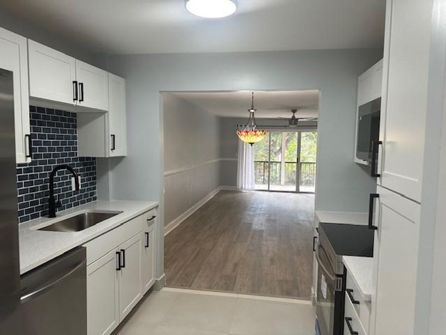 !! FANTASTIC LOCATION. ** condo in the heart of Coral Springs  ** LARGE 3 BEDROOMS 2 bathrooms (1,372sf) on the  SECOND  FLOOR NEAR ELEVATOR  CONDO WITH SPACIOUS LIVING AREAS,NEW KITCHEN WITH  SHAKER CABINETS  QUARTZ COUNTERTOPS, ALL NEW  STAINLESS STEEL APPLIANCES. TILE THROUGHOUT, WASHER & DRYER COMBO IN THE UNIT,  HUGE SCREENED IN PATIO. NEW ELECTRIC PANEL, New waterproof vinyl flooring , new hurricane impact  windows new bathrooms. TRANQUIL GARDEN AREA WITH POOL, ONE  ASSIGNED PARKING WITH TONS OF GUEST SPOTS. ACROSS FROM POLICE & FIRE, CLOSE TO SHOPPING, RESTAURANTS, HOUSES OF WORSHIP, PARKS AND EXCELLENT SCHOOL DISTRICT!! GREAT , UNIT CAN BE RENT AFTER A YEAR. Special Assessment (New roof 2025) paid in full by seller