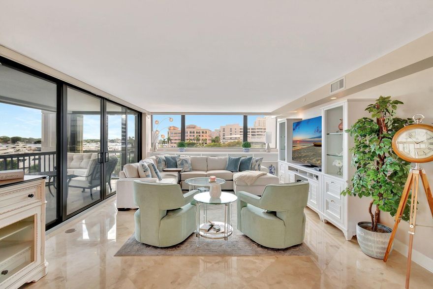 Experience unparalleled luxury and breathtaking Intracoastal views from this rarely available Southeast corner residence in Waterview Towers. Perched on the 5th floor, every major room--primary bedroom, living, dining, and kitchen--gazes out across the magnificent yachts of Palm Harbor Marina to the Flagler Museum and The Breakers. Enjoy a leisurely stroll across the north bridge for breakfast at Sant Ambroeus, or take in the bustling downtown West Palm Beach scene and the popular WPB GreenMarket every Saturday.  Inside, discover an expansive 3-bedroom, 3-bath layout, beautifully appointed with marble flooring throughout the main living areas and warm wood floors in the bedrooms. The well-equipped kitchen showcases marble countertops and a Sub-Zero refrigerator, perfect for