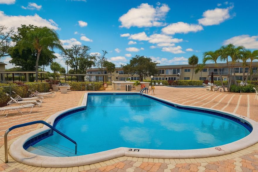 Located in the desirable Oriole Gardens 55+ community, residents enjoy excellent amenities for Low HOA fee paid quarterly: Resort-style Heated swimming pool, Clubhouse with game room, very active social activities and events space, Fitness area, Landscaped grounds with serene pathways, beautiful gardens, lush green spaces with mature palm trees, the perfect blend of comfort with amenities designed to make every day feel like a getaway. This ground level unit is one of the best values in the area — remodeled, clean, spacious, and ready for its next owner, with 2 Bedrooms / 2 Baths, updated open concept kitchen.   Prime Location: Conveniently situated near shopping, dining, golf courses, and major roads — everything you need minutes away while still enjoying a quiet, residential setting. Electric fire place, stainless steal appliances, modern tile throughout, recessed lighting, smooth no popcorn ceiling. Sold furnished with some exceptions.