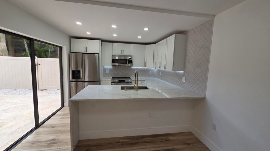 Welcome to the beautifully remodeled unit in the heart of West Palm. Walking distance to the High School.  Minutes to Elementary and Middle Schools. Walking distance to Cacti Park where Major Teams hold their spring baseball training. (Astros, Yankees, Mets, Marlins, Nationals) 3 different community amenity parks to use. All with saltwater pools, tennis, pickleball, racquetball, basketball, and toddler pools and playgrounds. With a fully secured courtyard with locking gate.  2 primary suites with ensuite bathrooms. 1/2 bath downstairs with Laundry in unit. Two assigned parking spots and plenty of guest parking. Water is also included in the rent. All of this just minutes from everything West Palm Beach has to offer.  Come see it today!!