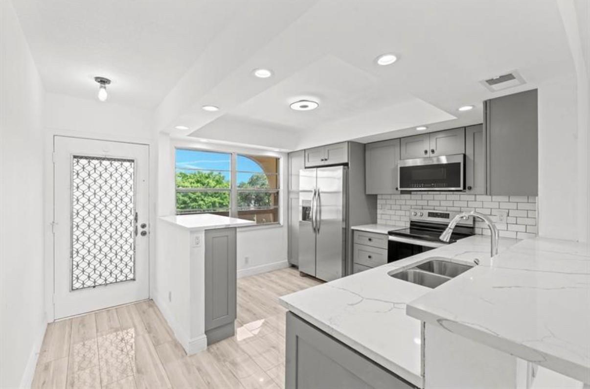 Fully remodeled Charming 55+ Condo with a stunning Lake View! Discover your dream home in this beautifully remodeled 2/2 unit. Enjoy serene lake views from your living room and bedroom, newly remodeled kitchen and bathrooms with contemporary finishes and brand-new appliances, and accordion shutters. Access to a community pool, fitness center, walking trails, and golf. Close to shopping, dining, and entertainment options. Don't miss out on this amazing opportunity to live in a beautifully updated condo in an amazing community!