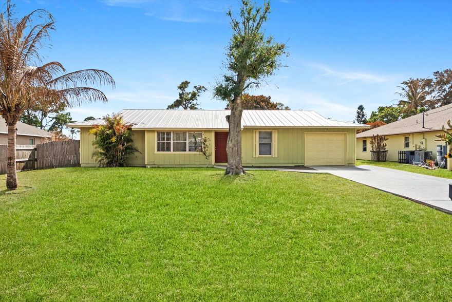 Located in an established neighborhood of Port St. Lucie, this home offers a great opportunity for buyers looking to personalize and add value. With a functional layout and solid footprint with a metal 2022 roof with Solar, it’s ready for cosmetic updates to truly shine. Spacious yard with room to enhance the outdoor living space, and no HOA restrictions to limit your vision. Conveniently located near shopping, dining, schools, and major roadways. Whether you're a first-time buyer wanting to build equity or someone looking for a project with upside, this property offers strong potential at an attractive price point.