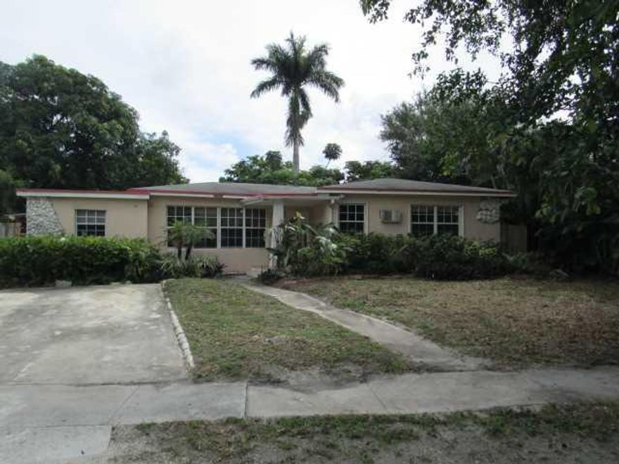 4 bed 3 bath single family, tile and carpet floors, covered front entrance, family room, laundry room, shed covered patio, fenced yard in Miami, close to everything!
