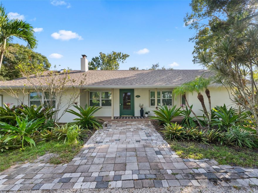 Florida coastal meets rustic farmhouse in this meticulously maintained CBS 4 bedroom / 3 bath home. Situated on a 1/2 acre lot in a secluded, yet convenient location to all that Vero has to offer. 2021 Roof, 2021 AC, 2021 Tankless Gas HWH. Newer appliances, island kitchen with custom light maple cabinetry, gas fireplace, and Saltillo tile. This open concept home has many more upgrades done with great attention to detail throughout. Split bedroom floorplan and the 4th bedroom could also be used as an in-law suite with a separate entry. A large screened in back porch overlooks a fenced yard with a firepit and ample room for a pool. There is also an oversized brick paver area for an RV, Boat, Jet skis, or additional parking for gatherings. Just minutes to the beach, shops, and dining.