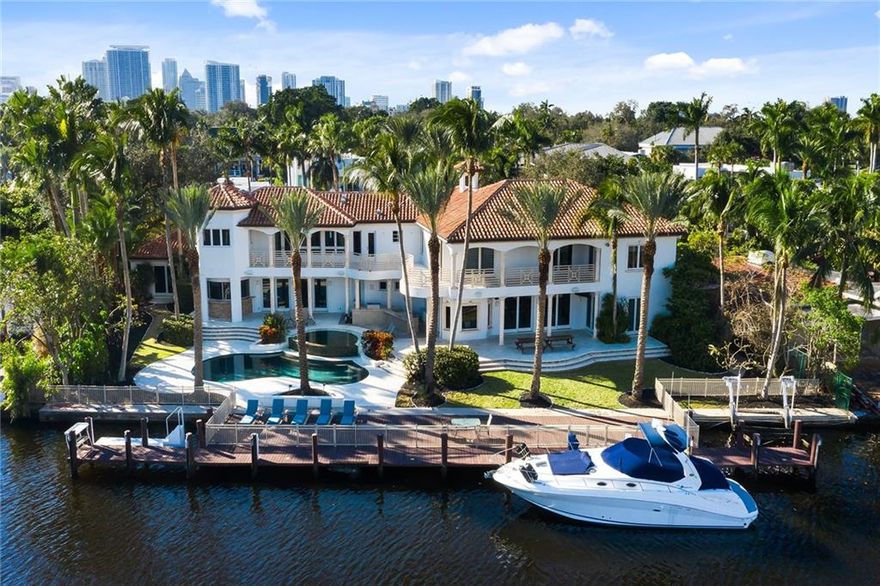 You have arrived at 112 S Gordon Road. This 7,388 SF waterfront estate is walking distance to Las Olas Blvd, the most coveted street of fine eateries and shopping in East Fort Lauderdale, sitting on an assemblage of three lots covering approximately 1/2 acre of property, 154 feet of deepwater frontage with no fixed bridges, and 117' of dockage. Navigate your yacht with ease on the 255' wide canal with easy turning. Built in 2001, the property features all impact windows and doors, a resort-style pool with a summer kitchen, gym, a new 80KW generator, LED lighting, sound system, a separate entertaining wing with a wet bar, and two master suites. Seek paradise and live the Fort Lauderdale lifestyle.
