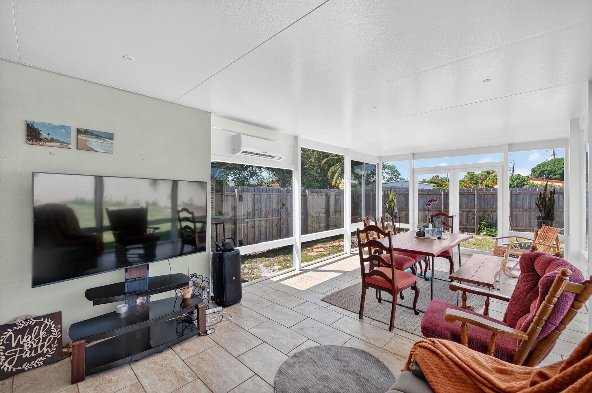 Welcome to this thoughtfully upgraded 3-bedroom, 2-bath home located on a spacious, newly fenced corner lot in the heart of Fort Lauderdale. Boasting 1,643 square feet of living space under air, this move-in-ready gem features two fully permitted Florida rooms (sunrooms) with commercial-grade impact windows and separate split-system AC units for year-round comfort.Step inside to discover bamboo flooring throughout, recessed lighting, new ceiling fans, and Hunter Douglas blinds. The modern kitchen is equipped with stainless steel appliances and flows seamlessly into the open living areas--perfect for entertaining. Both bathrooms have been stylishly remodeled, and the indoor laundry room adds everyday convenience.Enjoy peace of mind with a 7-year-old roof and a fully fenced yard