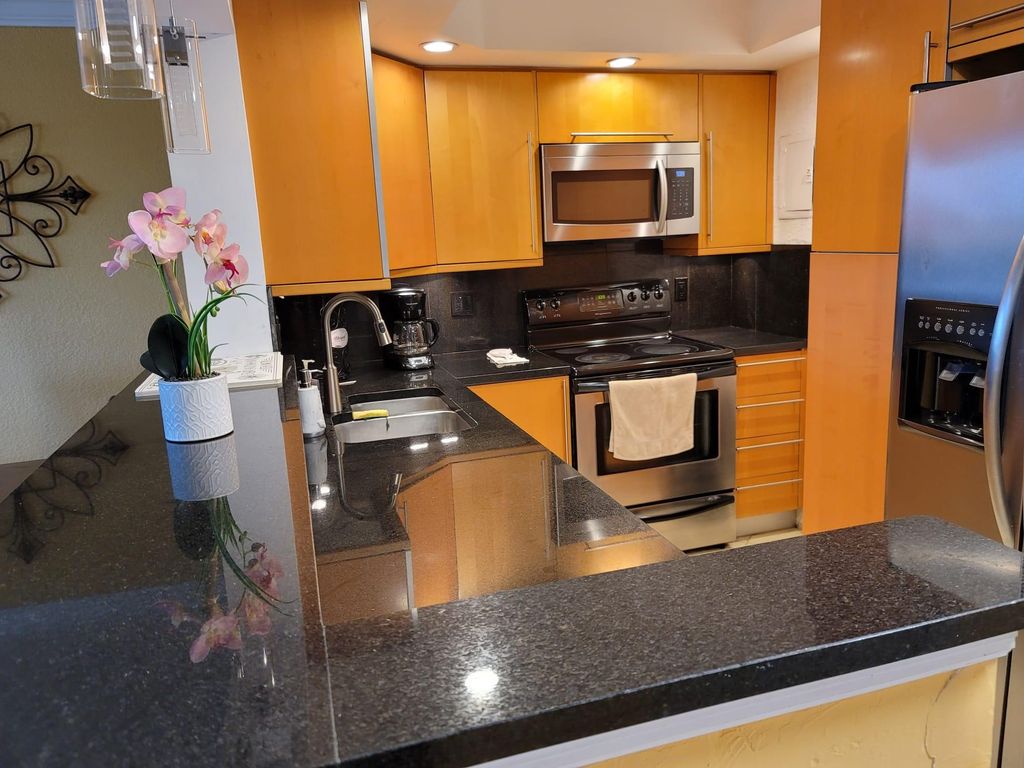 Photo of 401 Golden Isles Drive #1007, Hallandale Beach, FL 33009 (MLS # F10437921)