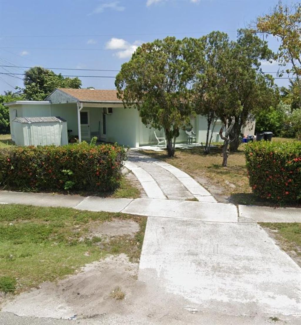 Photo of 3985 Tuskegee Drive Dr, Lake Worth Beach, FL 33462 (MLS # R10726910)