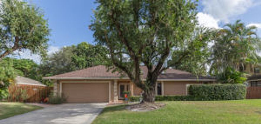 Don't miss this perfectly-remodeled pool home overlooking canal and preserve. Open kitchen includes high-end appliances, granite counter tops and beautiful glass-tile back splash and tile floors throughout. Vaulted ceilings make the home feel spacious and bright. Both baths are beautifully renovated to give a spa like feel. All bedrooms have large walk-in closets with wood closet systems. New impact windows, skylights and leaded glass front door. The large (48x23) covered patio is perfect for entertaining and pool overlooks canal and preserve. The spacious yard is fully fenced with a separate dog run on the side of the house. The irrigation pump was replaced last year and the roof in 2009.  This home is immaculately maintained and is move-in ready. Owner holds FL Real Estate license.