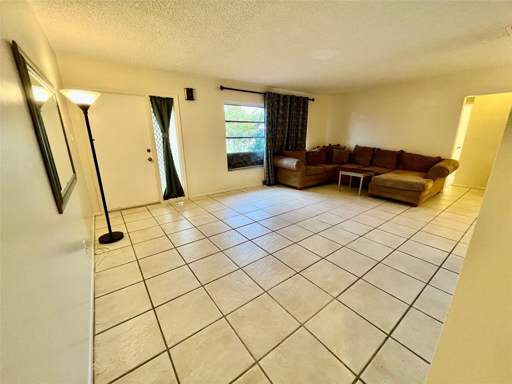 Photo of 6105 NW 73rd Ave, Tamarac, FL 33321 (MLS # F10517948)