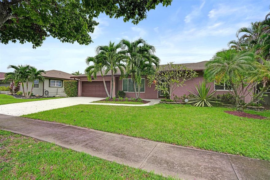 Welcome to Flamingo Gardens, one of Cooper City’s most loved, family-friendly pockets, where this bright single-story 4BR/2BA home blends peace-of-mind upgrades with easy indoor–outdoor living. A crisp curb appeal and full impact windows and doors set the tone, while light-filled living and dining areas flow into an open kitchen/family space that frames the backyard—perfect for weeknight dinners or weekend get-togethers. Big-ticket systems are already included with a 2016 roof, 2021 A/C, and 2018 water heater, and remodeled pool, giving you lower maintenance and potential insurance credits from day one. The lot offers room to play and entertain, and the single-level layout keeps daily life effortless.
