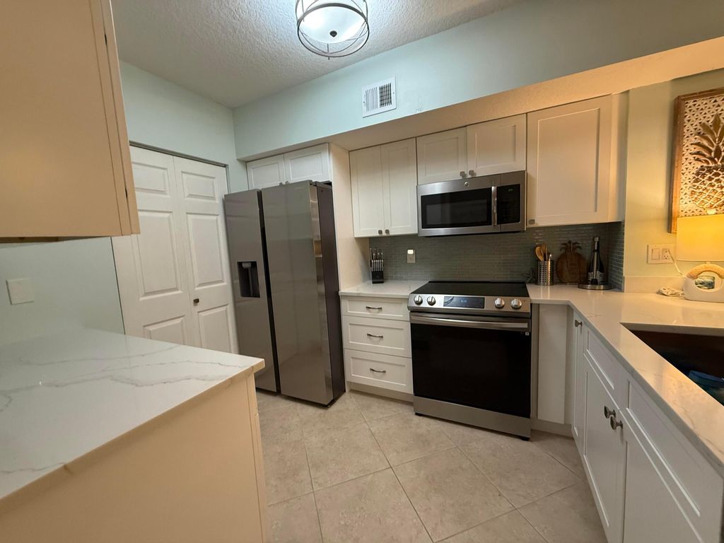 Photo of 236 Village Boulevard, Tequesta, FL 33469 (MLS # B26013298)