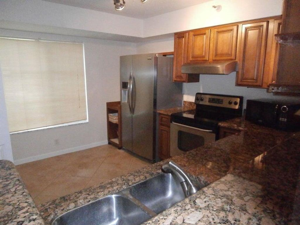 Photo of 103 Yacht Club Way #102, Hypoluxo, FL 33462 (MLS # R11056097)