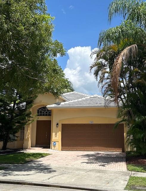 Bright & beautiful 4 bedroom, 2 bath, 2 car garage & 2 outside, pool home with nice view on Lake. Tile floor in living, dinning, family & kitchen and laminated in all bed rooms. Marble kitchen counter & New Stainless Steal appliances. Master bedroom walking closet. Laundry room with washer & dryer. Fabulous community amenities: Nice clubhouse /3 pools/tennis/ pickeball/basketball/volleyball/soccer/fitness gym/jacuzzi's/Child play area. Gated community & security patrol. HOA includes grass, sprinklers, alarm, basic cable, A+ Rated Schools. 4 bedroom & 2 bathroom home with lake views and pool in Pembroke Isles .