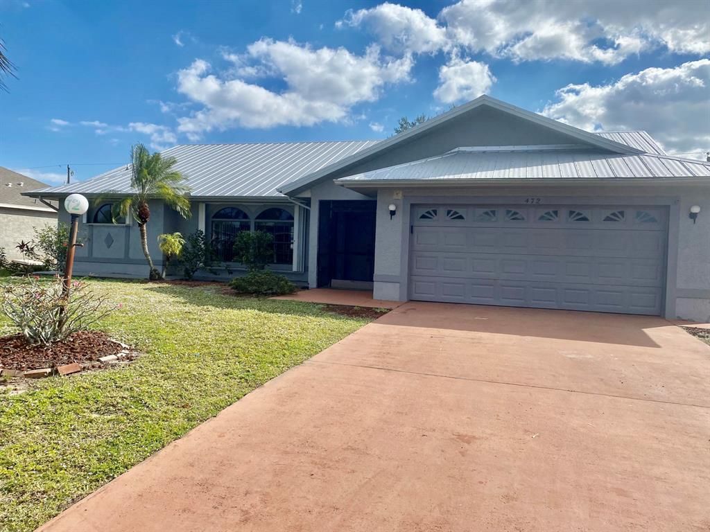 Photo of 472 SE Wallace Terrace, Port Saint Lucie, FL 34983 (MLS # R10762720)