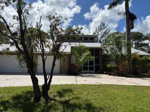 Photo of 12404 N 88th Place N, The Acreage, FL 33412 (MLS # R11135643) Photo of 12404 N 88th Place N, The Acreage, FL 33412 (MLS # R11135643)
