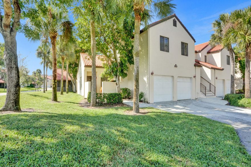 Corner Unit in gated complex. South Lake is a hidden gem in the heart of Boynton Beach. Kitchen has updated cabinets, SS appliances, undermount sink and Granite counters. Entire unit fully repainted, new wood style floors in both bedrooms, garage floor just repainted with flake finish. Walk in closets in both bedrooms, huge master bedroom, fully screened patio. 1 car garage with washer and dyer. 1 attached Garage parking space and 1 assigned driveway space in front of the garage. Additional parking in community lot. HOA pays Roof Repairs and replacement, insurance, cable, internet, management fees, common area maintenance. Community also offers tennis courts, pool, clubhouse, picnic area and a full gym. Schedule your showing today, priced to SELL!