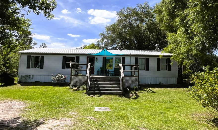 Spacious 3-bedrom,2-bath mobile home offering 1,512 sq ft in peaceful St. Cloud, Fl. Situated on nearly an acre (.924), this property is perfect for those seeking country living with room to roam. Enjoy no HOA restrictions and bring your animals-ideal for a small homestead or hobby farm. Plenty of outdoor space for gardening, recreation or relaxing in a quiet, private setting.  Conveniently located near wildlife management areas, perfect for outdoor enthusiasts. A great opportunity to enjoy rural charm while still being close to town conveniences.