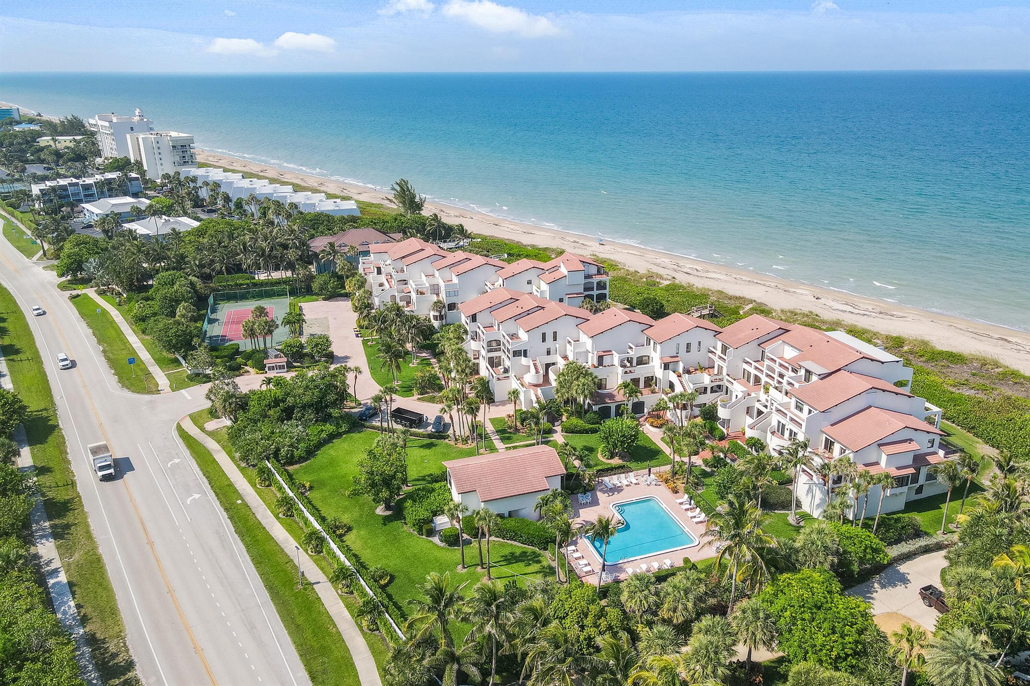 Welcome to this Oceanfront Mediterranean Oasis. This south end townhouse unit with unobstructed ocean views. Large, open, layout 4 verandas with incredible sunrise and sunset viewpoints; floor to ceiling sliders allow for indoor-outdoor living. This 2 level coastal townhouse offers 2 bedrooms, 3 baths, tongue, and groove high vaulted ceilings, impact doors and/or hurricane shutters. Brand new kitchen with smart appliances and a 10 foot island. Bedrooms with en-suite bathrooms, the primary suite includes a walk-in closet, ocean views right from your shower, wake up to the sound of waves rolling in. The only unit with 2 private entrances that lead directly to the unit. Gated community of 31 homes: private beach entrance, heated pool, tennis court and sauna. 2,813 sq ft indoor/outdoor spaces