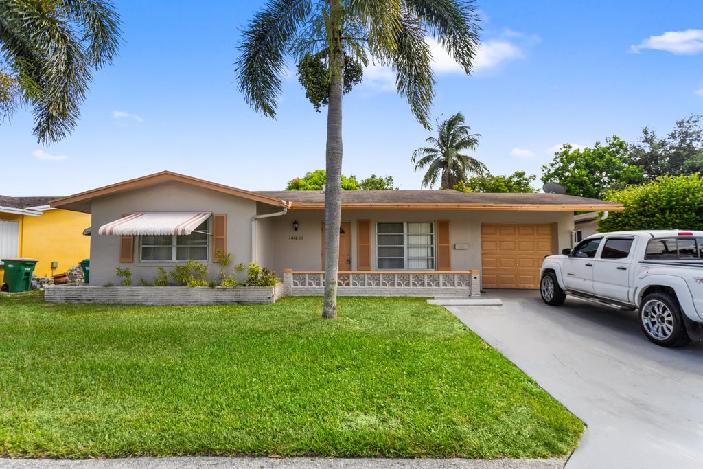 Photo of 4818 NW 58TH Street, Tamarac, FL 33319 (MLS # B26067831)