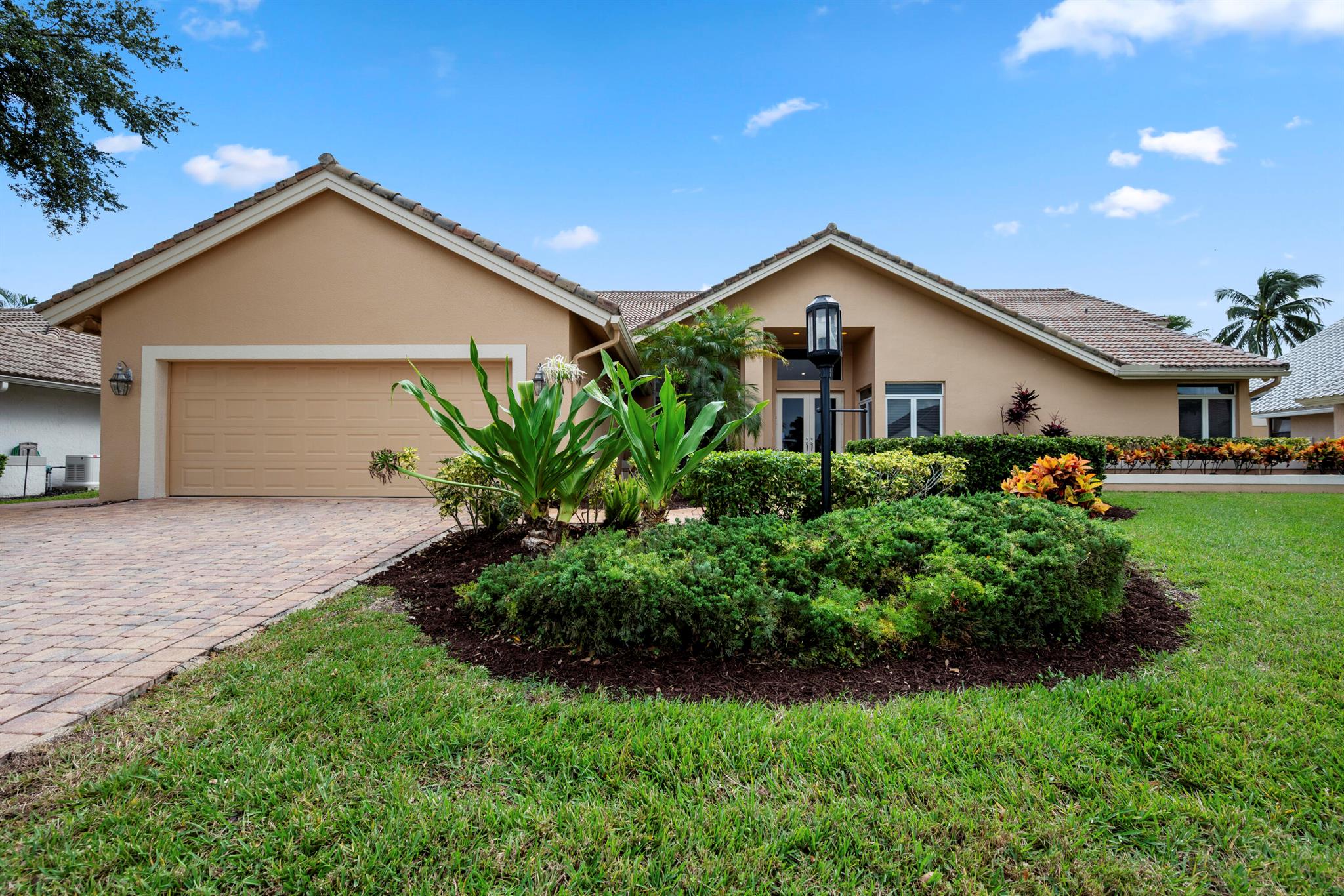 Welcome to this stunning, updated 3-bedroom, plus den, 3.5-bathroom home in the prestigious Stonebridge Country Club! A beautiful combination of golf course and lake views, this property offers the perfect combination of modern elegance, privacy, and resort-style living. The spacious, open-concept layout features a bright and airy kitchen, great room, and dining area that seamlessly flow together--perfect for both entertaining and everyday living. Large windows and glass doors allow for breathtaking views of the sparkling lake from most rooms in the home, creating a peaceful and picturesque backdrop at every turn.