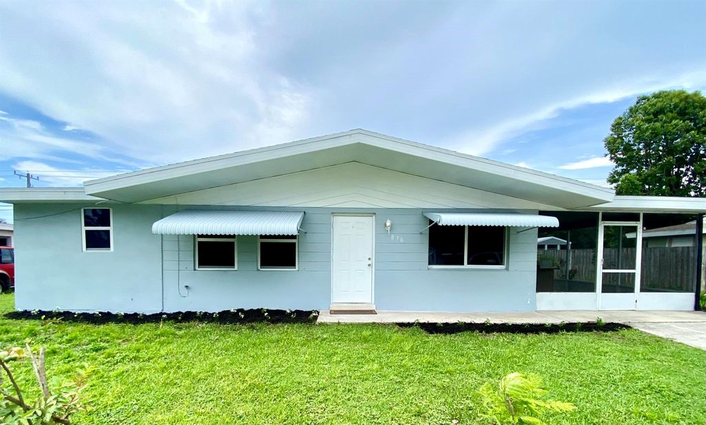 Photo of 870 SW Airoso Boulevard, Port St Lucie, FL 34983 (MLS # R10916907)