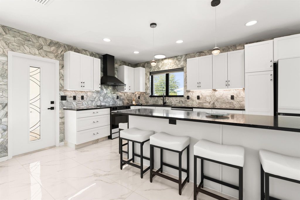 Photo of 1428 N M Street, Lake Worth Beach, FL 33460 (MLS # R11146988)