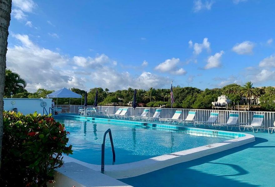 Perfect location at an AFFORDABLE price!, A1A AND MANALAPAN, walking distance to BEACH,  dining and shops.1/1 corner unit  and easy access to elevator and assigned front  parking. Heated pool and deck, in a private setting. Impact windows and electric shutterAll additional assessments paid in full and Milestone Inspections completed.GREAT AND HAPPY COMMUNITY!