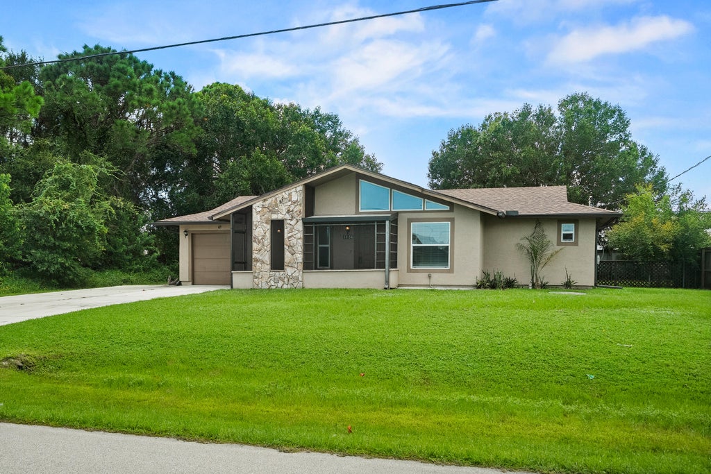 Photo of 1156 SW COLEMAN Avenue, Port Saint Lucie, FL 34953 (MLS # B26075277)