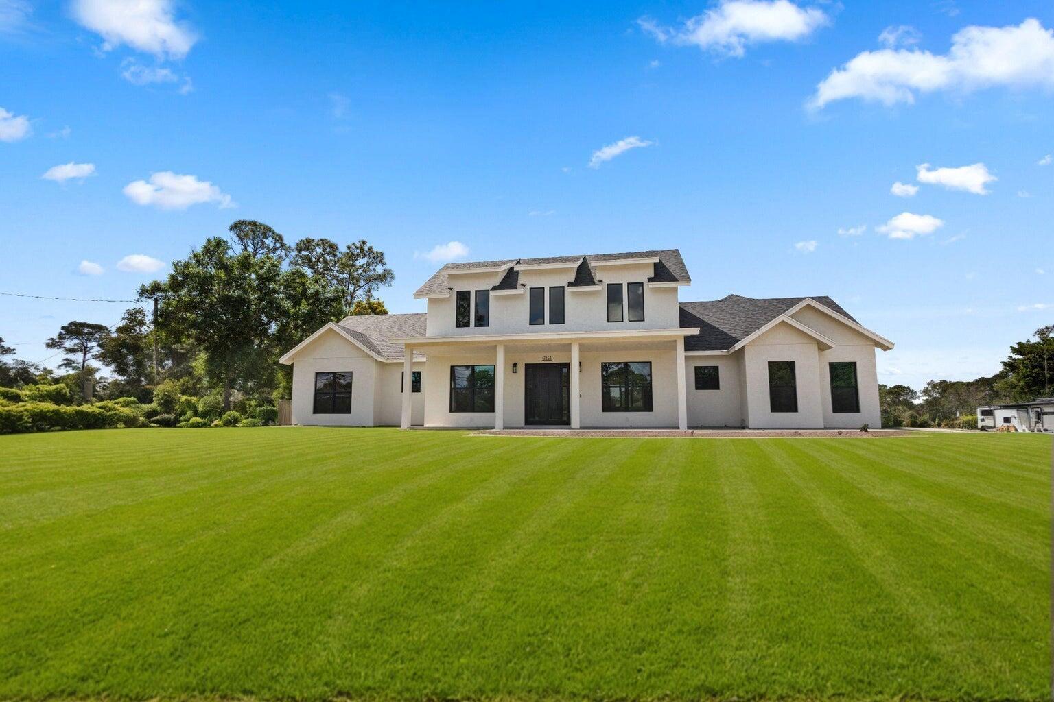 Luxury New Construction - Exceptional Value!Experience refined country living with this custom-designed modern farmhouse set on a sprawling 1.14-acre estate. Offering 4 spacious bedrooms, 3 elegantly appointed bathrooms, and an oversized 3-car garage, this 4,676 sq. ft. residence combines timeless farmhouse charm with cutting-edge design and technology.The open-concept floor plan flows seamlessly through expansive living spaces, adorned with high-end finishes and premium appliances. Energy-efficient systems ensure comfort, sustainability, and long-term value.Outdoors, the vast property invites endless possibilities for a private backyard retreat--from a resort-style pool to lush gardens or entertaining spaces.Ideally located just minutes from the pristine beaches of Palm Beach!